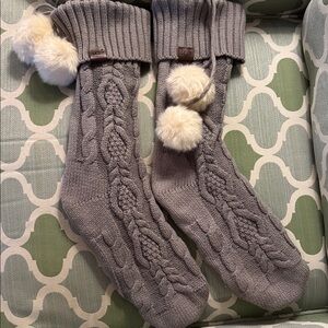 Pair of Ugg gray sweater stockings with white fur Pom poms